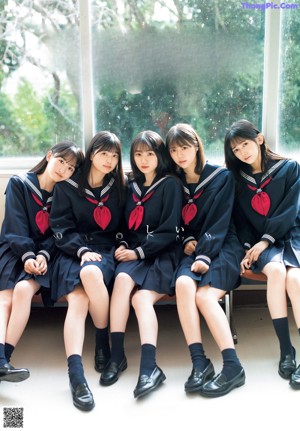 A magazine with a bunch of girls on the cover.