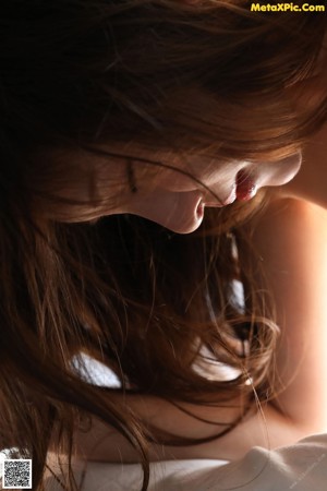 A close up of a woman's breasts in the sunlight.