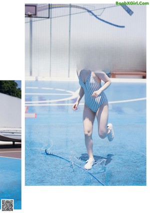 A woman in a blue and white striped bathing suit running on a basketball court.