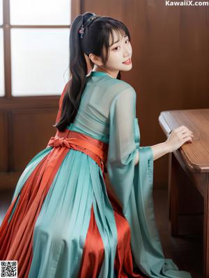 a woman wearing a pink and blue hanbob