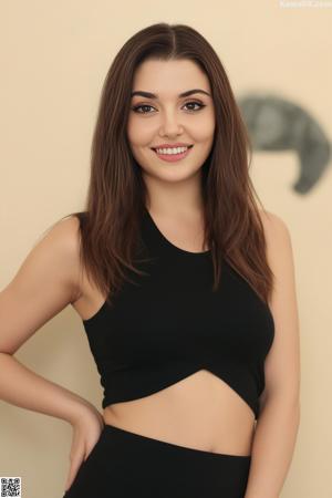 A woman in a green bra sitting on a yellow couch.
